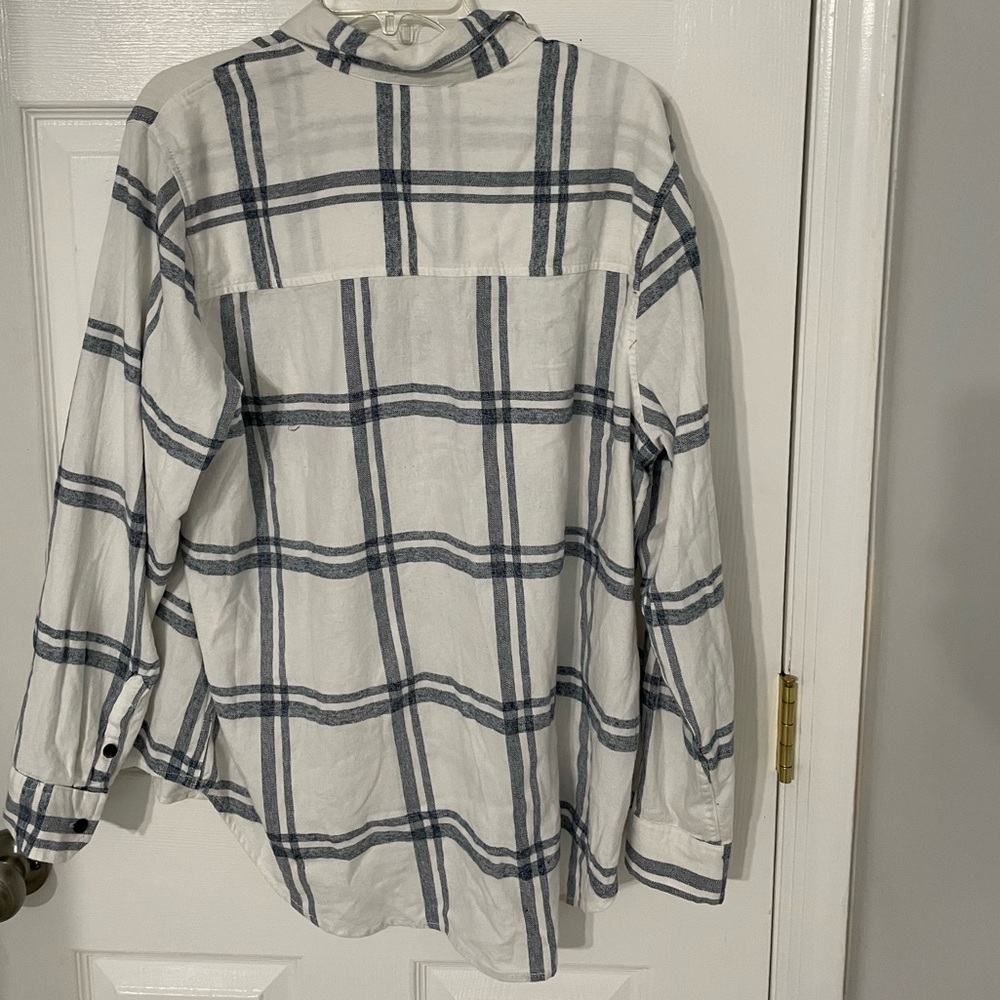 White and blue plaid button down shirt. Never worn.
